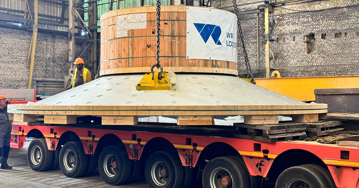 One of two oversized ball mill gears loaded onto a trailer in France