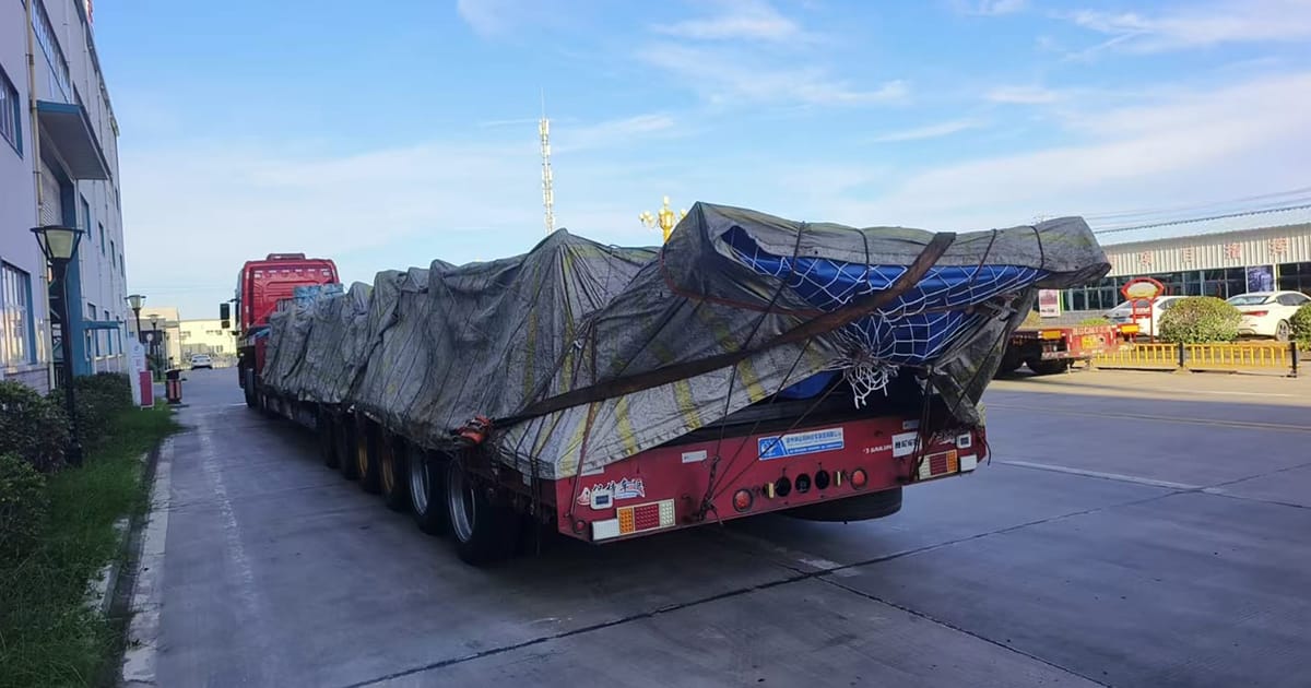 Loaded hemispherical heads on Chinese trailer at departure site