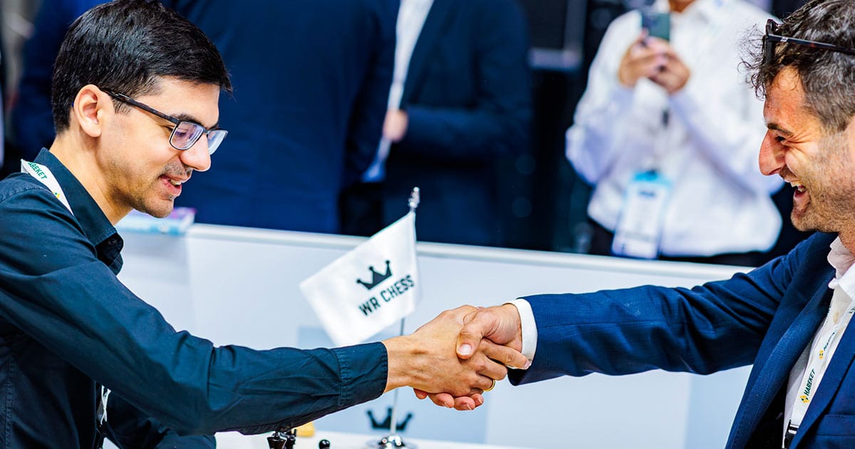 Anish Giri shakes hands after a chess match at Breakbulk Europe 2025