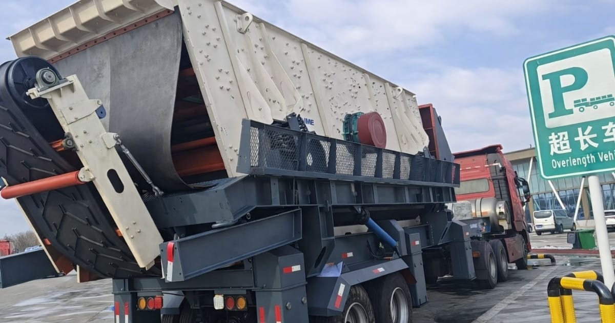 Crushing and screening plant equipment loaded on trailer for transport